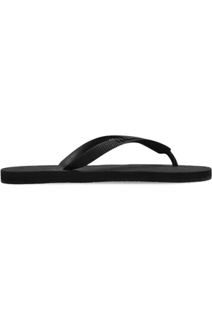 Vetements Flip flops con logo en relieve