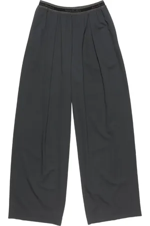 Acne Studios Pantalones con franjas del logo