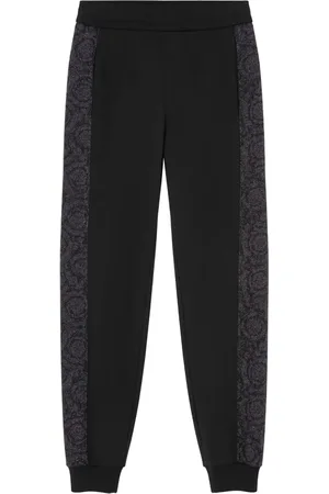 VERSACE Pants con rayas laterales