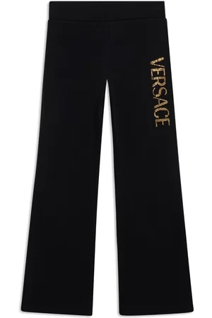 VERSACE Pants con logo y detalles