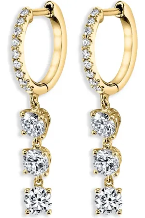 Anita Aretes estilo huggie en oro amarillo de 18kt con diamantes