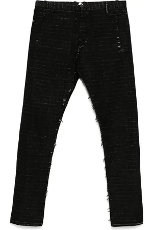 UNDER CONSTRUCTION Pantalones con efecto envejecido