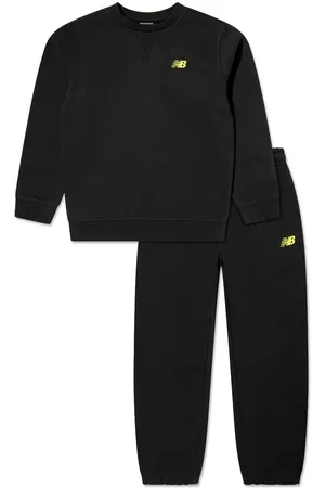 New Balance Traje deportivo con logo bordado