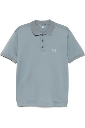C.P. Company Playera tipo polo con parche del logo
