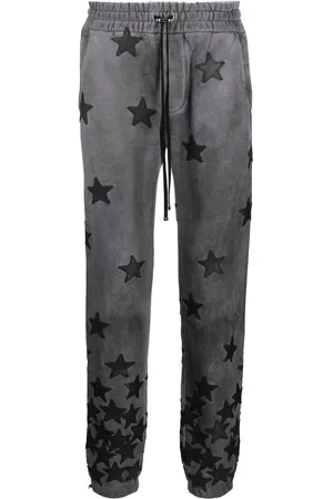 AMIRI Pants con motivo de estrellas