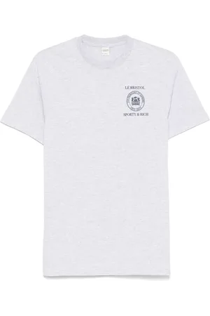 Sporty & Rich Playera 100th de Crest Seal de x Le Bristol Paris