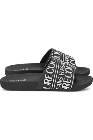 VERSACE Flip flops con logo engomado