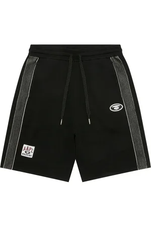 A Bathing Ape Shorts deportivos con rayas laterales