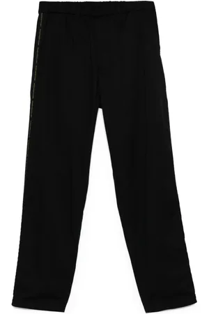 UNDERCOVER Pantalones con franja del logo