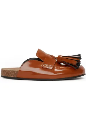 J.W.Anderson Mules de charol con borlas