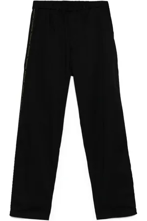 UNDERCOVER Pantalones con franja del logo