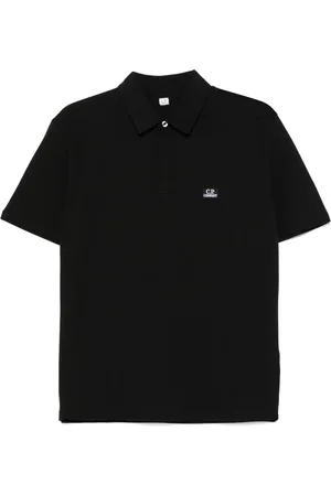 C.P. Company Playera tipo polo con parche del logo