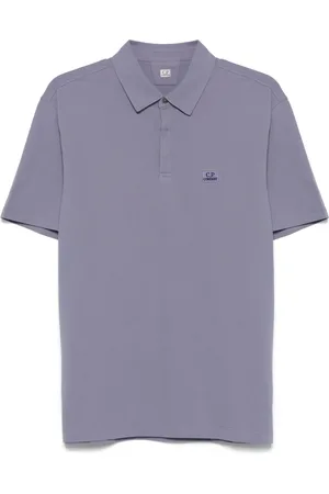 C.P. Company Playera tipo polo con parche del logo