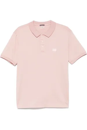C.P. Company Playera tipo polo con parche del logo