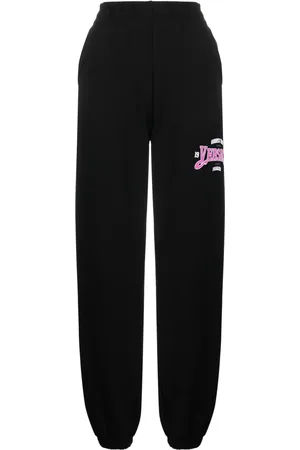 VERSACE Pants con logo estampado