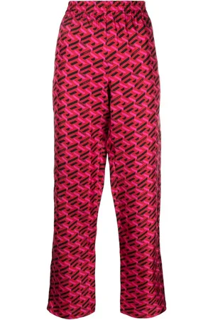 VERSACE Pantalones de pijama de seda con logo estampado