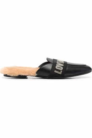 Moschino Mules con tira del logo