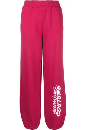 VERSACE Pants con logo estampado