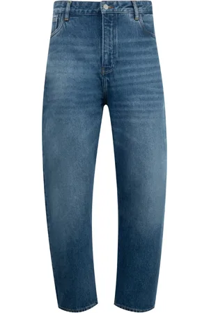 STUDIO NICHOLSON Jeans con parche del logo
