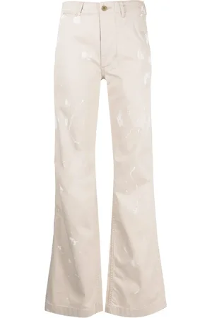 R13 Pantalones acampanados con estampado de salpicaduras de pintura
