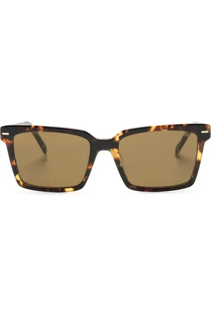 Miu Miu Lentes de sol con armazón cuadrada estilo carey
