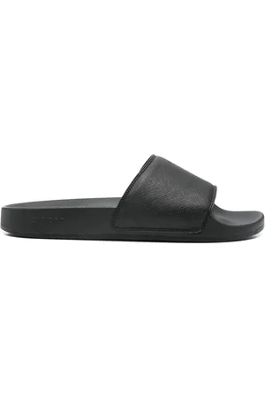Sandro Flip flops con logo estampado