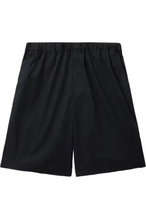 UNDERCOVER Shorts con ribete del logo