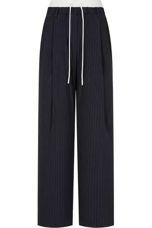 Studio Tomboy Pantalones anchos con rayas diplomáticas estampadas