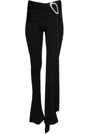 DAVID KOMA Pantalones con capa