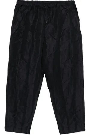 Comme des Garçons Pantalones con estampado de rayas diplomáticas