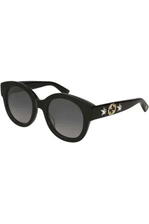 Gucci Lentes de sol con armazón redonda oversize y detalles de estrellas