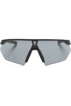 adidas Lentes de sol con armazón geométrica