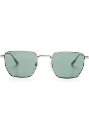 Lacoste Lentes de sol con armazón geométrica y logo grabado