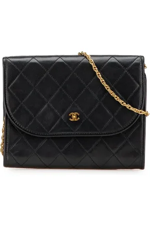 CHANEL Bolsa crossbody Flap mini redonda de piel de cordero capitonada con logo CC 1984-1986