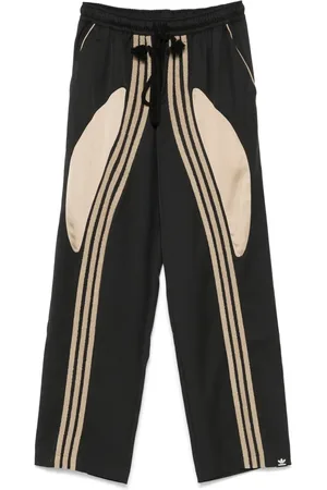 SONG FOR THE MUTE Pantalones entretejidos en colaboración con adidas