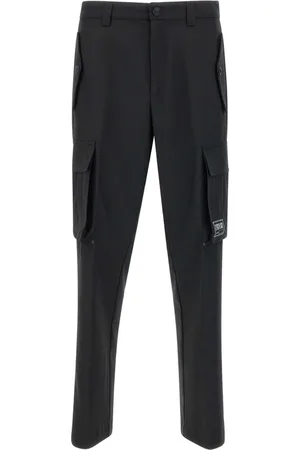 VERSACE Pantalones de vestir con parche del logo