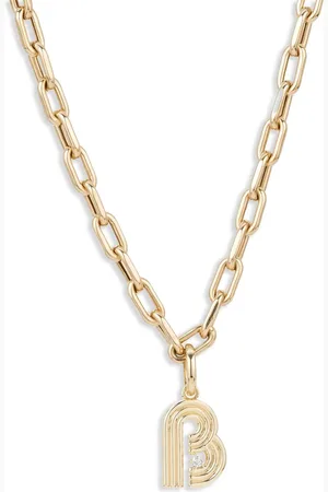 Adina Reyter Dije Initial en oro amarillo de 14kt con diamante