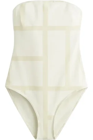 Totême Traje de baño strapless con monograma