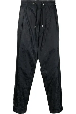 Balmain Pantalones de vestir con monograma estampado