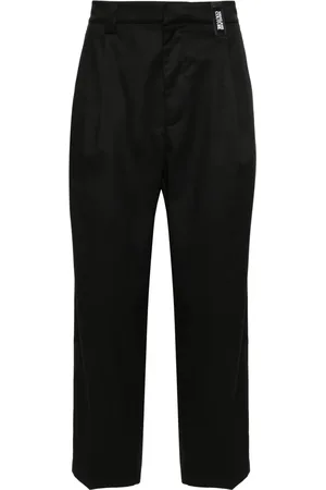 VERSACE Pantalones con aplique del logo