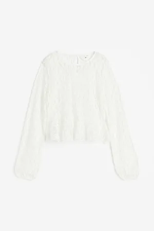H&M Blusa de encaje con peplum
