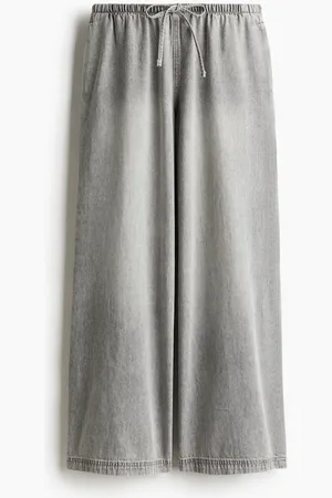H&M Pantalón de denim con cordón de ajuste