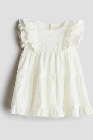 H&M Vestido con olanes en bordado inglés