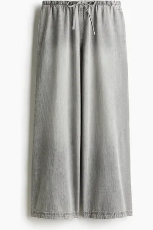 H&M Pantalón de denim con cordón de ajuste