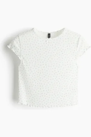 H&M Top de pointelle con detalle overlock