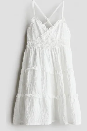 H&M Vestido en punto smock con olanes