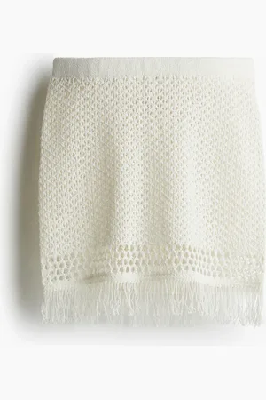 H&M Minifalda en tejido pointelle con borde de flecos