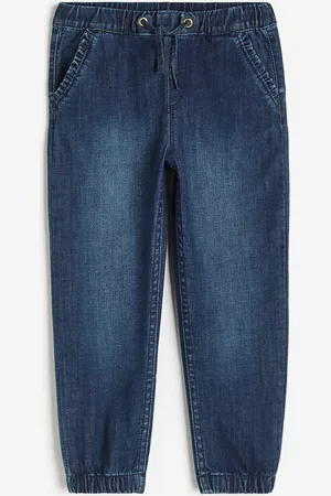 H&M Joggers de denim con bordes de olán