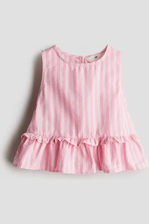 H&M Top con peplum en algodón
