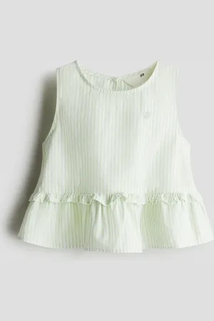 H&M Top con peplum en algodón
